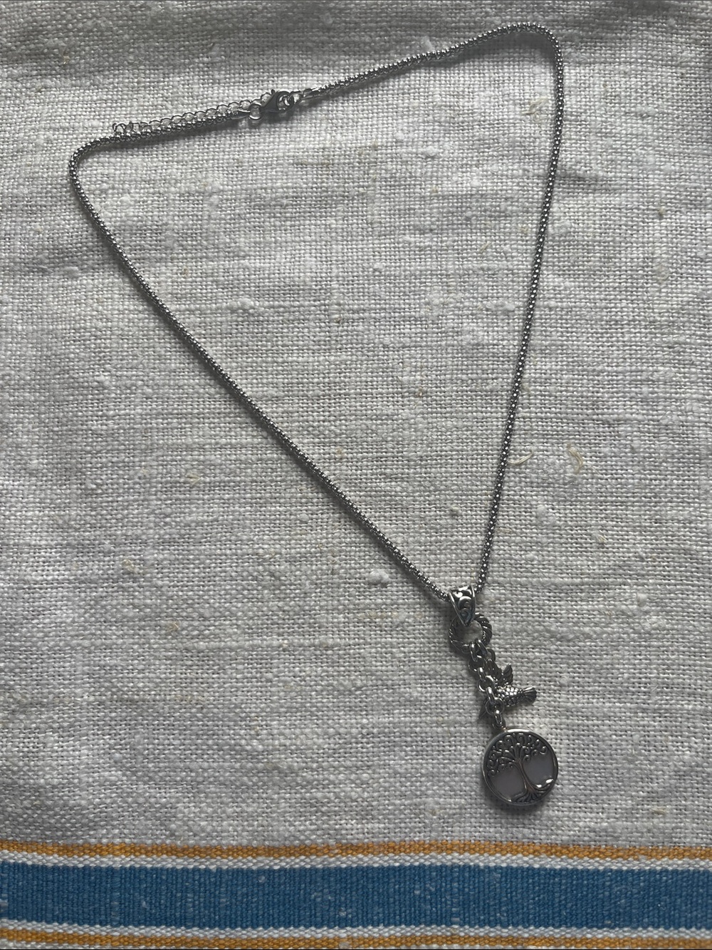 sterling silver and mother-of-pearl necklace with hummingbird and tree of life